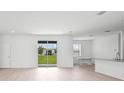 Open-concept living area with sliding glass doors leading to the backyard at 2138 Blaser St, Punta Gorda, FL 33980