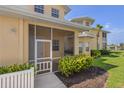 A relaxing screened-in porch with lush greenery and a view, perfect for enjoying the outdoors in comfort at 25555 Heritage Lake Blvd # 27, Punta Gorda, FL 33983