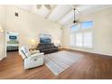 Bright living room with high ceilings, hardwood floors, and plenty of natural light at 3724 Bordeaux Dr, Punta Gorda, FL 33950