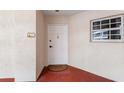 Condo front door with unit number and a welcome mat, and window on the right side at 3730 Cadbury Cir # 616, Venice, FL 34293