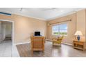 Cozy living room featuring neutral walls, wood flooring, and comfortable seating at 3730 Cadbury Cir # 616, Venice, FL 34293