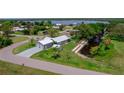 Expansive aerial view of a lovely single-Gathering home, boasting a private dock and a detached garage at 405 Ridgecrest Dr, Punta Gorda, FL 33982