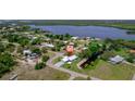 Scenic aerial shot highlights this home's waterfront location with private dock, near a calm canal at 405 Ridgecrest Dr, Punta Gorda, FL 33982
