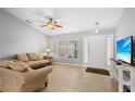 Cozy living room with neutral tones and tile flooring at 4268 Leesburg Ave, North Port, FL 34288