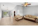 Open-concept living space with natural light and comfortable seating at 4268 Leesburg Ave, North Port, FL 34288