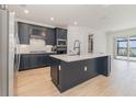 Modern kitchen featuring an island, stainless steel appliances, and stylish cabinets at 42771 Valley Brooks St, Punta Gorda, FL 33982