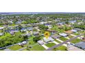 A tranquil neighborhood showcases single-Gathering homes with waterfront access and lush greenery at 4509 Wynkoop Cir, Port Charlotte, FL 33948
