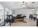 Bright living area with a ceiling fan, neutral walls, and contemporary furniture at 5273 Crestline Ter, Port Charlotte, FL 33981