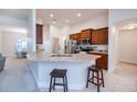 Open kitchen with stainless steel appliances, ample counter space, and a breakfast bar with seating for casual dining at 591 San Ambrosio St, Punta Gorda, FL 33983