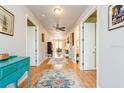 Hallway with hardwood floors leading to dining room at 7424 Acorn Blvd, Punta Gorda, FL 33982