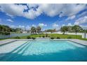 A beautiful pool with a waterfall feature and a spacious backyard at 1523 Napoleon Rd, North Port, FL 34288