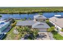 A beautiful waterfront home with a lush yard and easy access to the water at 18566 Arapahoe Cir, Port Charlotte, FL 33948