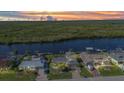 Scenic aerial view of waterfront homes with docks and lush green surroundings at 18566 Arapahoe Cir, Port Charlotte, FL 33948