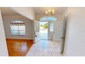 Bright foyer with tile flooring, high ceilings, and an open view of the front yard at 2244 Mauritania Rd, Punta Gorda, FL 33983