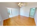 Spacious living room with hardwood floors, natural light, and neutral wall color at 2244 Mauritania Rd, Punta Gorda, FL 33983