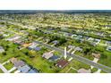 An aerial view showcases the neighborhood and this property's location in a well-planned community at 264 Rotonda N Blvd, Rotonda West, FL 33947