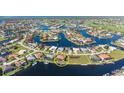 Aerial view of waterfront homes in a beautiful community with many canals at 3322 Sandpiper Dr, Punta Gorda, FL 33950