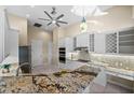 Bright kitchen featuring granite counters, stainless appliances, and ample cabinet space at 3322 Sandpiper Dr, Punta Gorda, FL 33950