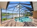 Enclosed pool with a view of the water at 3322 Sandpiper Dr, Punta Gorda, FL 33950
