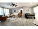 Open-concept living and dining area boasting stylish decor, neutral tones, and lots of natural light at 4854 Flamlau Ave, North Port, FL 34287