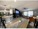 Inviting living space with a modern kitchen, comfortable seating, and an entertainment center at 4854 Flamlau Ave, North Port, FL 34287