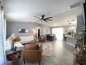 Bright and airy living room featuring modern furnishings, decor, and an open floor plan at 4854 Flamlau Ave, North Port, FL 34287