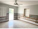 Spacious room with large window and ceiling fan awaiting personalized finishing touches at 617 W Olympia Ave, Punta Gorda, FL 33950