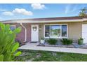 Close up shot of the front of the house, with a succulent garden, and stylish cactus plants at 6382 Cutler Ter, Port Charlotte, FL 33981