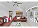 Cozy living room with plantation shutters, crown molding, and comfortable seating at 1722 Amnesty Dr, North Port, FL 34288