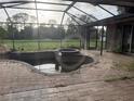 Screened-in pool area with brick patio offers a relaxing outdoor space at 2143 Santonian Ter, North Port, FL 34286