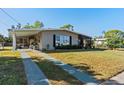 Attractive single-story home with a convenient covered carport and a delightful screened-in porch at 3197 Normandy Dr, Port Charlotte, FL 33952