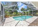 Screened-in pool offers privacy and enjoyment with ample space for relaxation and outdoor entertaining at 3305 Nansen Ln, North Port, FL 34286