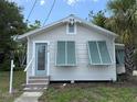 Charming single-story home with a front entrance featuring decorative gable trim at 420 W Olympia Ave, Punta Gorda, FL 33950