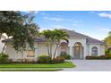 Charming home boasts lush landscaping, a well-manicured lawn, and an inviting front entrance at 4334 Corso Venetia Blvd, Venice, FL 34293