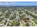 Expansive aerial view of the property showcasing its location within a lush, green neighborhood, close to water at 1053 Yarmouth St, Port Charlotte, FL 33952