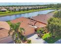 Aerial perspective of the property highlighting its lakeside location and community setting at 1775 Scarlett Ave, North Port, FL 34289