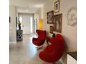 Inviting entryway featuring tile flooring, artwork and distinctive decor, showcasing a warm and stylish home at 25224 Lahore Ln, Punta Gorda, FL 33983