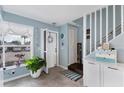 Inviting foyer features tile flooring, stairs to the upper level, and lots of natural light at 26310 Rampart Blvd # 504, Punta Gorda, FL 33983