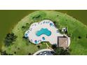 Aerial view of a community pool with plenty of seating and well manicured landscaping at 2736 Suncoast Lakes Blvd, Punta Gorda, FL 33980