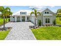 Charming single-Gathering home with a metal roof and brick paver driveway at 28960 Gin Ln, Punta Gorda, FL 33982