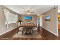 Elegant dining room featuring a large table, stylish decor, and ample natural light at 496 Fletcher St, Port Charlotte, FL 33954