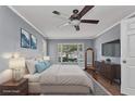 Inviting bedroom with a bay window, neutral tones, and comfortable furnishings at 496 Fletcher St, Port Charlotte, FL 33954