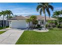 Charming single-Gathering home featuring a well-manicured lawn and attached two-car garage at 531 Madrid Blvd, Punta Gorda, FL 33950