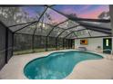 Inviting screened-in pool area perfect for relaxation and entertaining at 6514 N Biscayne Dr, North Port, FL 34291