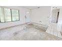 Bright living room with neutral carpet and a large window at 6540 Kenwood Dr, North Port, FL 34287