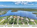 An impressive view of this waterfront home and its landscaping and surrounding natural beauty at 17509 Ohara Dr, Port Charlotte, FL 33948