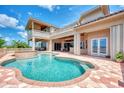 Resort-style pool with a spa, an outdoor bar area, and covered patio at 17509 Ohara Dr, Port Charlotte, FL 33948