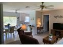 Open-concept living room offering a view into the adjacent dining and kitchen areas at 18094 Ackerman Ave, Port Charlotte, FL 33948
