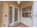 Inviting front entrance with double doors, a side window, and brick pavers for a warm welcome at 2630 Tarpon Cove Dr # 211, Punta Gorda, FL 33950