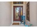 A charming front door with glass, decorative elements, and a 'Welcome' mat at 2712 Arugula Dr, North Port, FL 34289